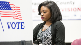 Female African-American voter at voting booth